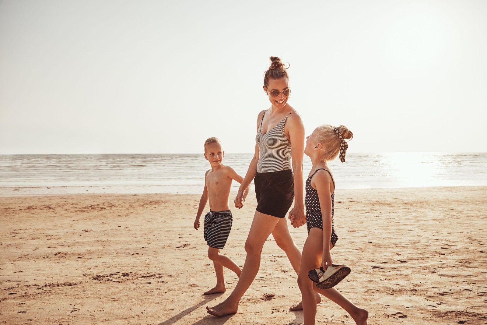 Mom and Kids Walking at Beach