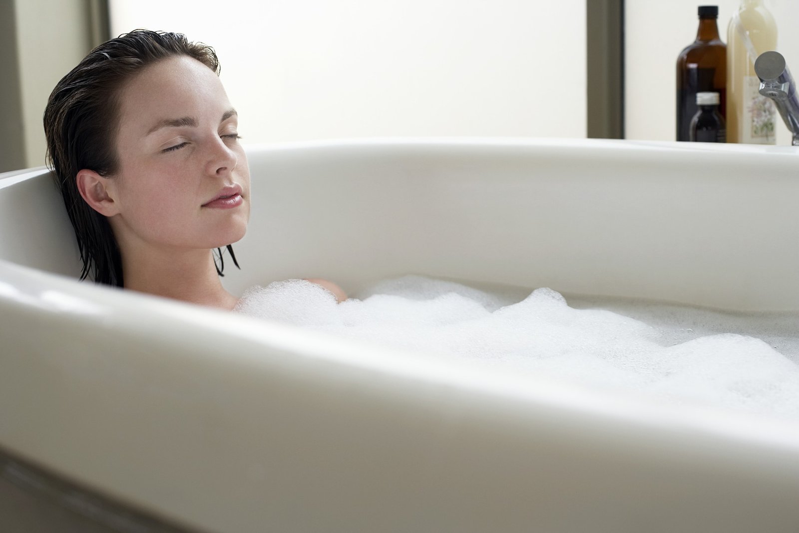 Woman Relaxing in Bath - Postpartum Herbal Baths