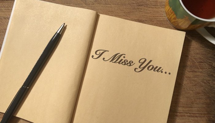 I Miss You written in notebook